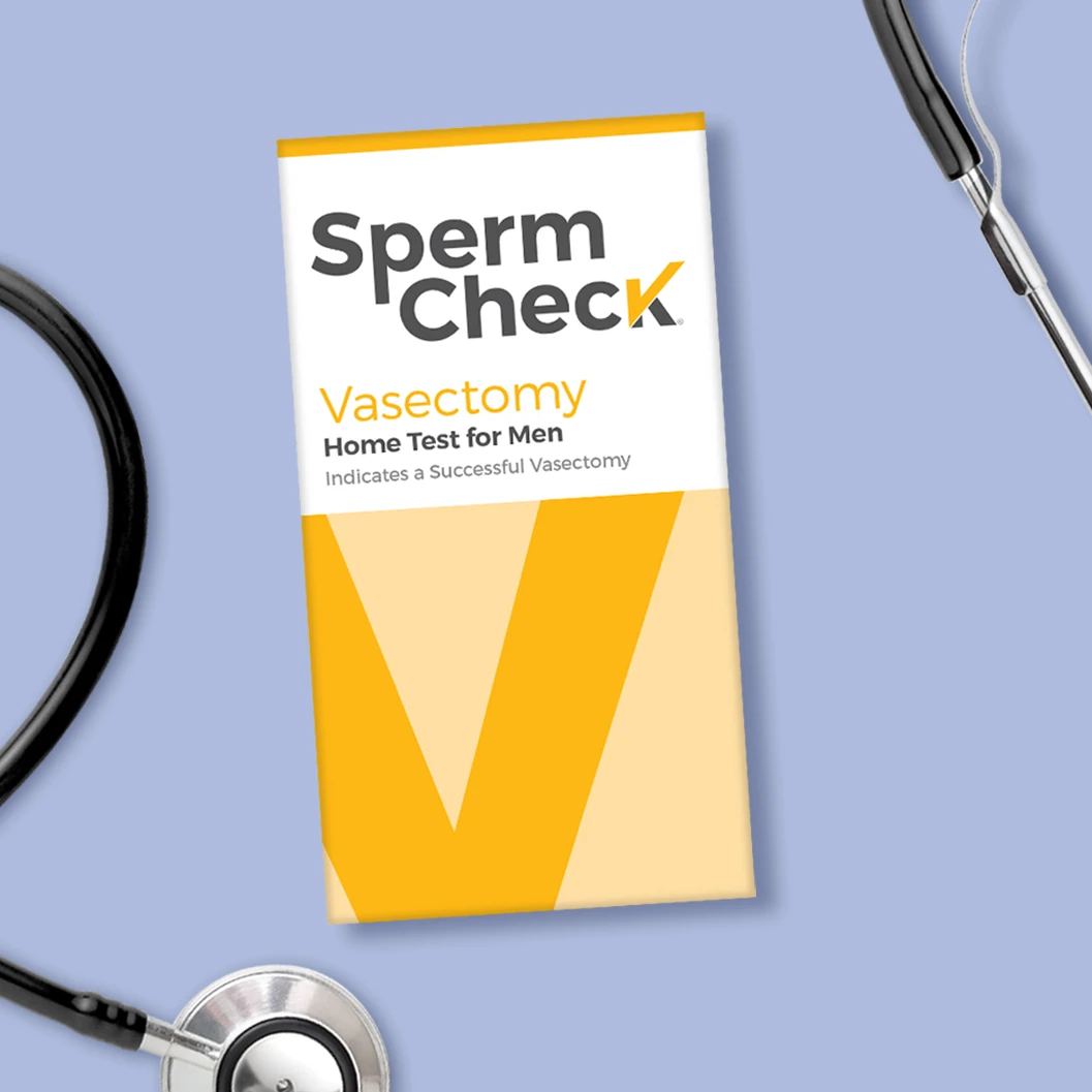 SpermCheck vasectomy test and stethoscope on purple background